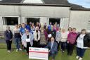 The 4 Winds trustees and representatives of the successful groups at the presentation of grants at Lumphinnans Community Bowling Club.