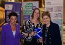 Claire Henderson (centre) was presented with her award by former First Minister Nicola Sturgeon.