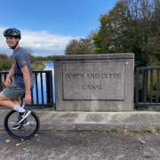 Finlay Cooper is travelling from Glasgow to Edinburgh on his unicycle.