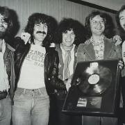 Nazareth in the early days with one of their many awards. Left to right: Darrell Sweet, Manny Charlton, Dan McCafferty, manager Derek Nicol and Pete Agnew.