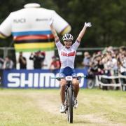 Great Britain cyclist Evie Richards celebrates winning the Women’s Elite XCO Race at the UCI World Championships in Italy in 2021.