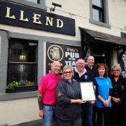 The team at the Hillend Tavern celebrating one of their award successes. Now they've been praised in the Westminster parliament.