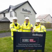 Peter Lawrie with Belway Homes Ltd (Scotland East)'s Construction Director John Dierikx and Managing Director Tracey Brady.