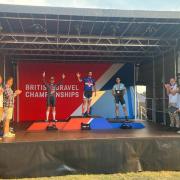 Silas Goldsworthy (centre) on the podium after his British Gravel Championship success.