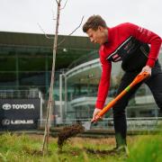 Rory Butcher has been planting trees at racing venues around the country in a bid to offset his carbon footprint.