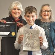 Ben Tennant, of Touch Primary School, took first prize in the art competition. He's pictured with Anne McFarlane and Dot Adams.