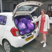 Slimming World consultant Samantha Moat with some of the donated clothes sacks.