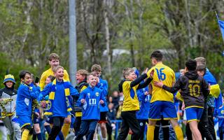 Youngsters with the Swifts joined the senior team in celebrating Sunday's cup win.