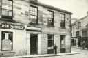 Cash Stores, James Kyle menswear store and, just visible, Coull and Matthew ironmongers shop, pictured in 1927.