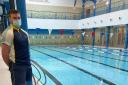 Reece Gordon, leisure attendant with Fife Sports and Leisure Trust welcomes Ewan Hunter (Dunfermline), one of the first customers, back to the training pool.