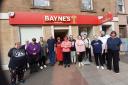 Express Group Fife members receive the donation from Bayne's Bakers.