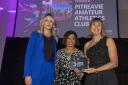 Pitreavie AAC's Nicky Compston and Nicola Moriarty receive the award from Fiona MacKenzie, assistant commissioner at MG ALBA. Photo courtesy of Scottish Women in Sport.