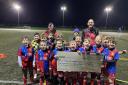 Members of the Norrie McCathie development squad receiving the grant.