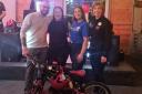 Logan was also able to present Faith with a bike thanks to Halfords Dunfermline. Pictured, left to right, Michael Russell, Kaylin MacDuff, Logan Dowie, and Ellise, manager at Halfords at Halbeath Retail Park.