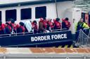 A group of people thought to be migrants being brought to Dover, Kent, on a Border Force vessel following a small boat incident in the Channel