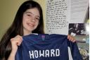 Inverkeithing Hillfield Swifts under 12s footballer Robyn Clarkson with her shirt from Scotland defender Sophie Howard.