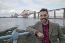 Tim Dunn, presenter of the Yesterday TV programme, The Architecture The Railways Built, at the Forth Bridge. Photo: UKTV/Brown Bob Productions