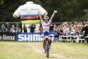 Great Britain cyclist Evie Richards celebrates winning the Women’s Elite XCO Race at the UCI World Championships in Italy in 2021.