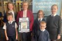 Dalgety Bay Primary youngsters bid a fond farewell to retiring minister Christine Sime