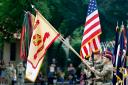 An honour guard displays the colours of Fort Bragg as a part of the renaming ceremony (Karl B DeBlaker/AP)