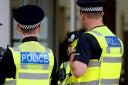 A Dunfermline woman has admitted assaulting two police officers.