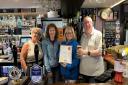 Pictured, from left Bar staff Helen Lynas and LA Mathieson, owner Francesca Henderson and Fife CAMRA Regional Director Stuart.