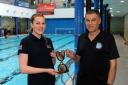 Zara Christie is presented with her SASA East District Junior Water Polo of the Year trophy by Richie Metcalfe, Dunfermline Water Polo Club secretary. Photo: David Wardle.