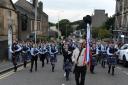The traditional parade before Inverkeithing's Hat and Ribbon Race.
