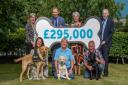 Representatives of Guide Dogs and Scotmid with the £295,000 donation.