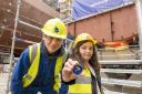 Electrical fitter Robbie Dick and coin designer Jessica Davidson, aged 7, at the keel laying ceremony for HMS Active.