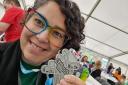 Cllr Auxi Barrera with her Kiltwalk medal, having raised funds for Autism Rocks.