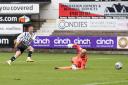 Michael O'Halloran slots the ball past Jamie McDonald for Dunfermline's crucial third goal on Saturday.