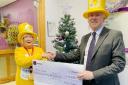 Cathy Scott, of Marie Curie, is delighted to accept the £10,000 donation from Andrew Croxford, of Thomson Cooper.