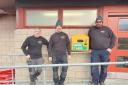 The ACR Electrical team with the defibrillator at the Fleet Grounds