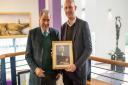 William Garner, George Lauder's Great-Great Grandson, presents a framed photograph of George Lauder to College Principal Jim Metcalfe to mark the 125th anniversary .
