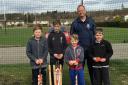 Dunfermline and Carnegie president Richie Barclay and some of the club's aspiring young cricketers.