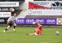 Michael O'Halloran slots the ball past Jamie McDonald for Dunfermline's crucial third goal on Saturday.