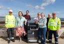 Councillors and Fife Council workers with one of the new solar bins.