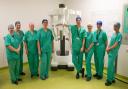Members of NHS Fife's theatres team alongside the Da Vinci robotic device
