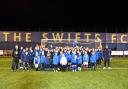 Douglas Chapman MP (far left) and Gez Gibson (far right) line up with some of the 105 registered girls currently playing for Swifts FC.