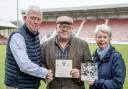 Trustees Donald Adamson and Christine Scott receive the 'We Are the Pars' single from Stuart Miller.