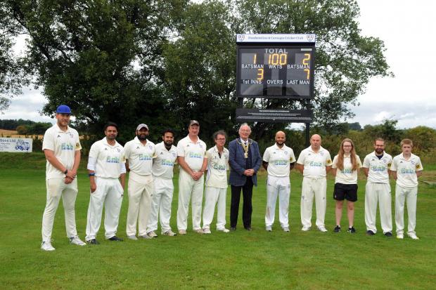 Members of Dunfermline and Carnegie's first XI with Fife Provost, Jim Leishman, at the unveiling of a scoreboard in memory of late club stalwart Tom Gibson. It took place prior to the rained off match with Holy Cross. Photo: Dave Wardle.