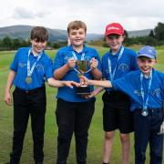 Sam Miller, Hector Stobbie, Rory Stevenson, and Cameron Craig show off their trophy and medals. Photo: Scottish Golf.