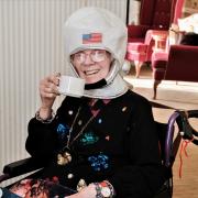 Resident Sylvia Hayes dressed as Neil Armstrong for afternoon tea. Photo: Andrew Crozier/Four Seasons Health Care