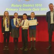 Rotary Club of Dunfermline’s President Mr Ralph McCran with the winning St Margaret's team of Jessica Bathgate, Jeffrey Tan, Molly Clarke and Elizabeth Wasiak.