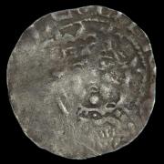 The silver penny depicts Malcolm IV of Scotland, with his face just about visible.