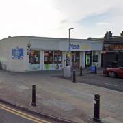 The mobile phone network known as Three want to put a telecommunications mast outside this shop in Rosyth.