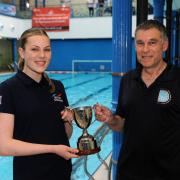 Zara Christie is presented with her SASA East District Junior Water Polo of the Year trophy by Richie Metcalfe, Dunfermline Water Polo Club secretary. Photo: David Wardle.