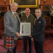 Savannah Mortimer with Provost Jim Leishman and Charlie Brine from the Kilt Company in Dunfermline.