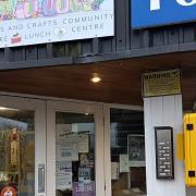 The defibrillator is located outside the community hub.